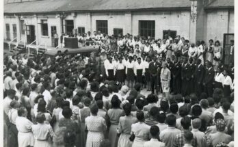 Workers at Labor Day exercises gather to hear a chorus of Arsenal workers sing spirituals; Picatinny Arsenal, Dover, N. J., 13 Dec. 1944